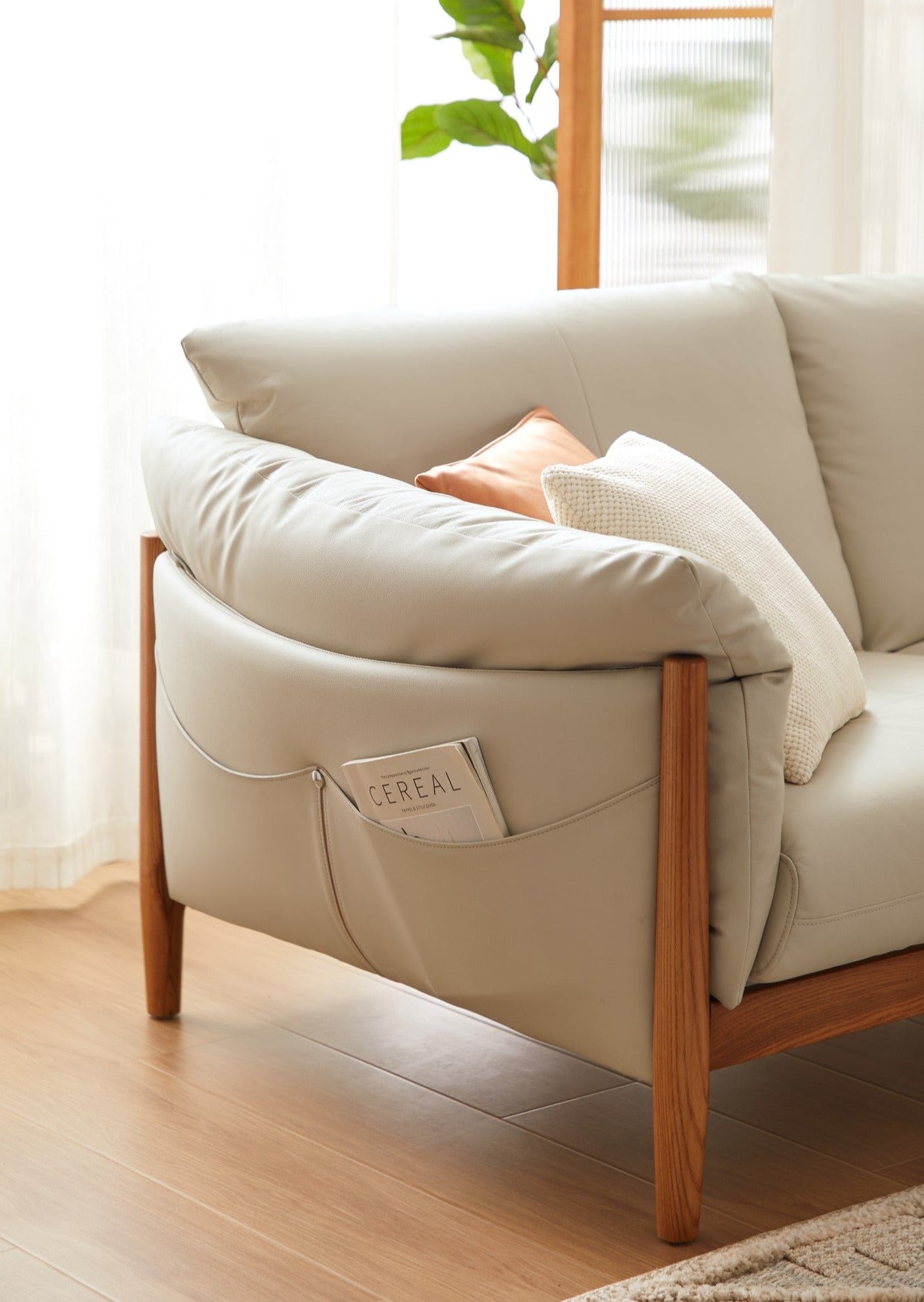 Upgrade your living space with our sleek and stylish sofa featuring convenient side pockets for added storage.