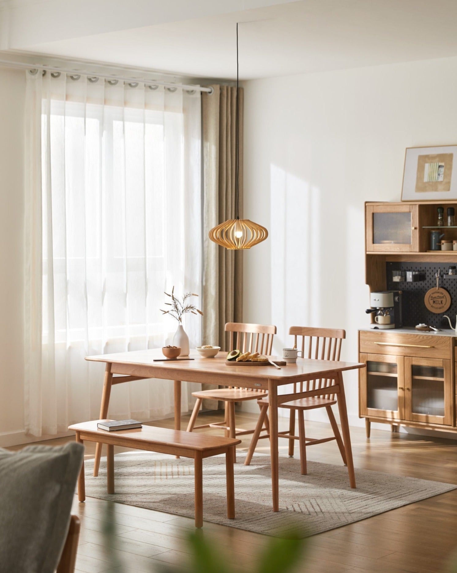 Elevate your dining experience with our solid wood dining table, complete with matching chairs and bench. Crafted for both durability and elegance.